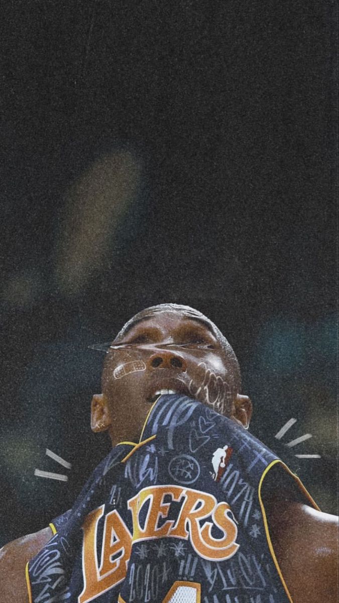 an image of a basketball player that is in the air with his hands on his face