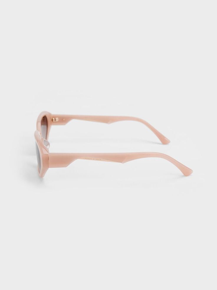 Put the perfect finishing touch on a chic, feminine look with these acetate oval sunglasses. Simple yet stylish for maximum versatility, they feature tinted oval lenses and a geometric design along the temples. In sweet pink, this charming accessory is perfect for adding a pop of colour to any outfit. Slot these beauties into the accompanying protective case when you are not wearing them. Charles Keith, Oval Sunglasses, Feminine Look, Sunglasses & Glasses, Geometric Design, Protective Cases, Color Pop, Lenses, Product Launch