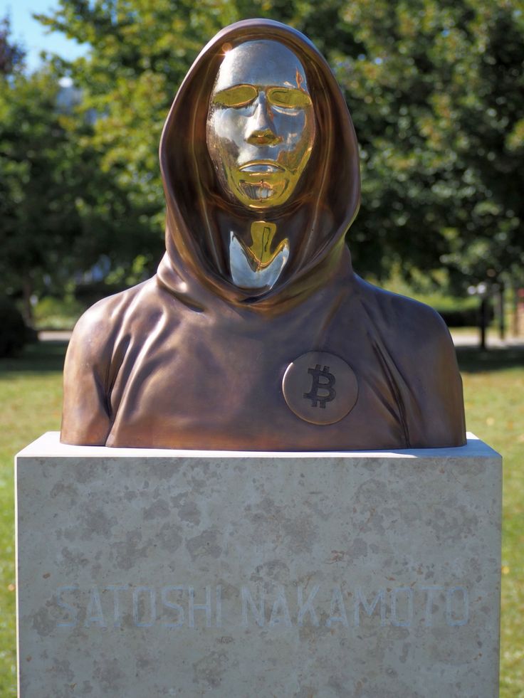 a statue of a woman wearing a headscarf with the words atushi makabatto written on it