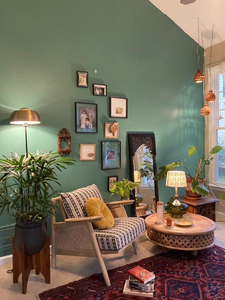 a living room filled with furniture and pictures on the wall