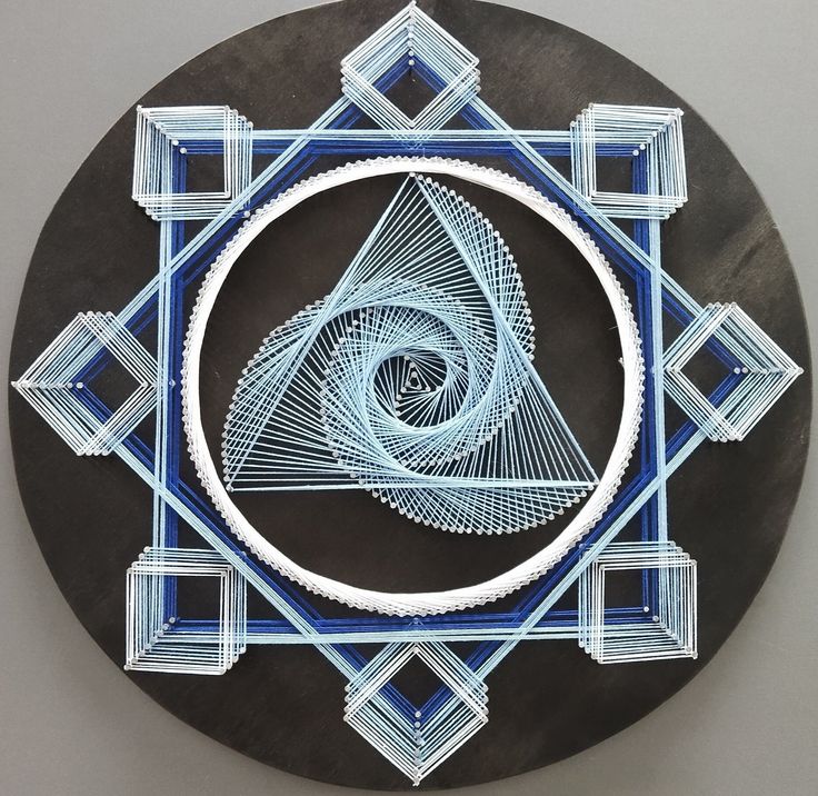 a black and blue plate with an intricate design on it's side, in the shape of a spiral