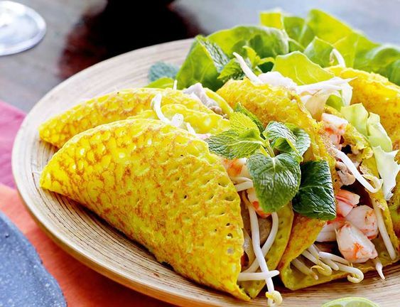 three tortillas are on a plate with lettuce and garnishes