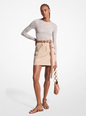 Capture the essence of utilitarian dressing in this cargo skirt. Made in Italy, it’s crafted from cotton gabardine and features a lightly crushed finish for modernity. Style it with a tucked-in sweater and luxe leather extras for a polished look. Fall Cargo Skirt With Pockets For Workwear, Cotton Cargo Skirt For Fall, Chic Fitted Cargo Skirt For Fall, Chic Fitted Skirt With Cargo Pockets, Chic Fall Cargo Skirt, Fitted Cotton Cargo Skirt For Fall, Fitted Cargo Skirt With Pockets For Workwear, Cargo Skirt, Michael Kors Collection