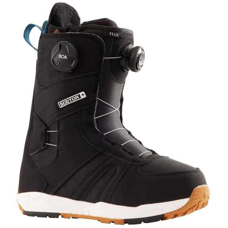 a pair of black snowboard boots sitting on top of a white floor