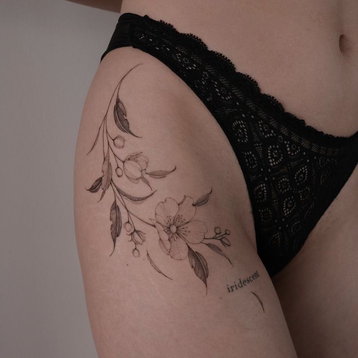 a woman with a tattoo on her thigh