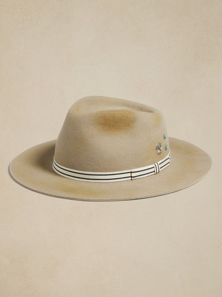 Handcrafted from a unique 200-gram blend of free-range Bolivian and Argentine wool, this Hampui hat has a striped hatband, an inentionally-distressed finish, and stamped silver medallions with turquoise cabochons.  HAMPUI: Rugged, yet always-refined, Cruise Outfits, Free Range, Hat Band, Winter Sale, Curator Style, Natural World, Baby Shop, Handmade Natural, Fashion News