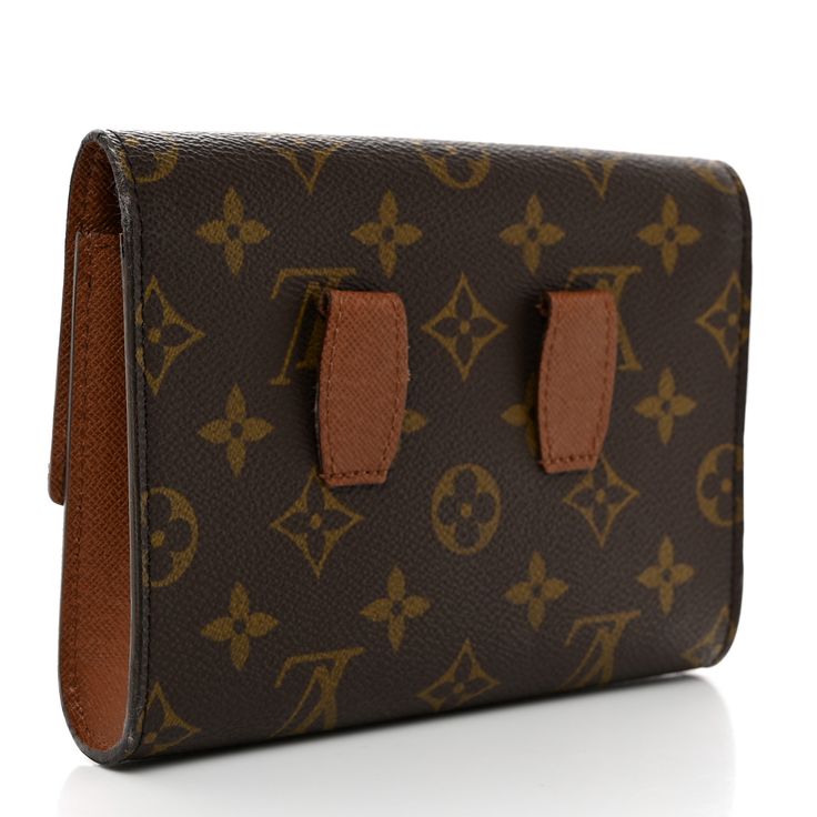 This is an authentic LOUIS VUITTON Pochette Ceinture Arche. This stylish pouch is crafted of Louis Vuitton monogram on toile canvas with cross grain leather trim and loops at the rear for a belt (belt is not included). The front opens to a terra cotta cross grain leather interior. This is a perfect pouch, ideal for small essentials, from Louis Vuitton! Pochette Louis Vuitton, Louis Vuitton Pochette, Terra Cotta, Leather Interior, Leather Trim, Authentic Louis Vuitton, Leather Trims, Louis Vuitton Monogram, Grain