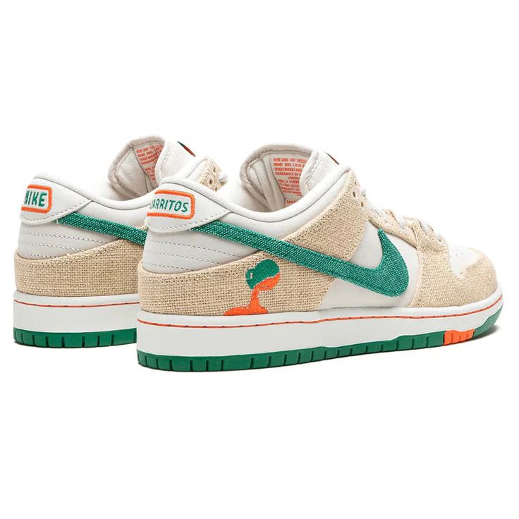 The Jarritos x Nike Dunk Low SB showcases a collaborative design inspired by the popular Mexican soda brand. The upper combines a white leather base with hemp canvas overlays and a green textile Swoosh. The Jarritos logo is embroidered in green and orange on the lateral heel, while dual branding embellishes the woven tongue tag. Mismatched heel tabs are emblazoned with ‘Nike’ and ‘Jarritos’ across the left and right shoe. Anchoring the sneaker is a durable rubber cupsole that pairs white sidewal Mexican Soda, Adidas Sl 72, Nike X Travis Scott, Mexican Drinks, Low Air Jordan 1, Baby Nike, Nike Swoosh Logo, Nike Sb Dunk Low, Adidas Spezial