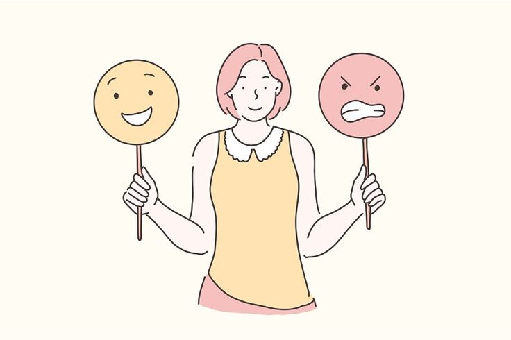 a woman holding two smiley face masks in her hands