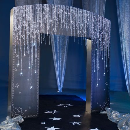 a stage with curtains and stars on the floor