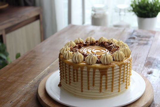 a cake sitting on top of a wooden table