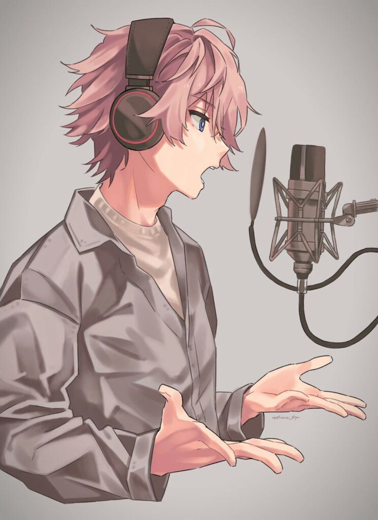 a man with pink hair and headphones in front of a microphone holding his hands out