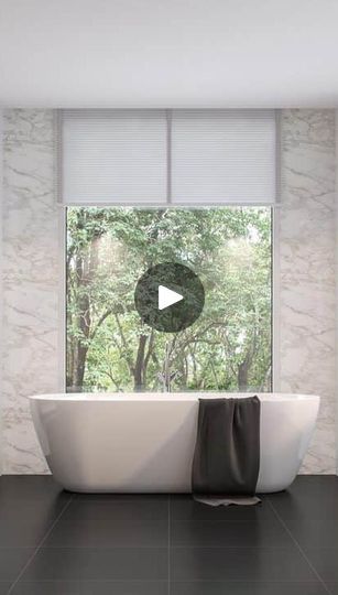 a white bath tub sitting next to a window