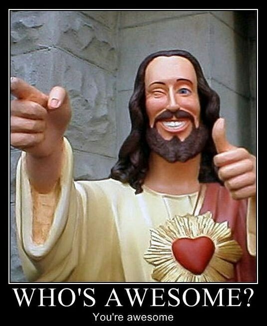 a statue of jesus giving the thumbs up