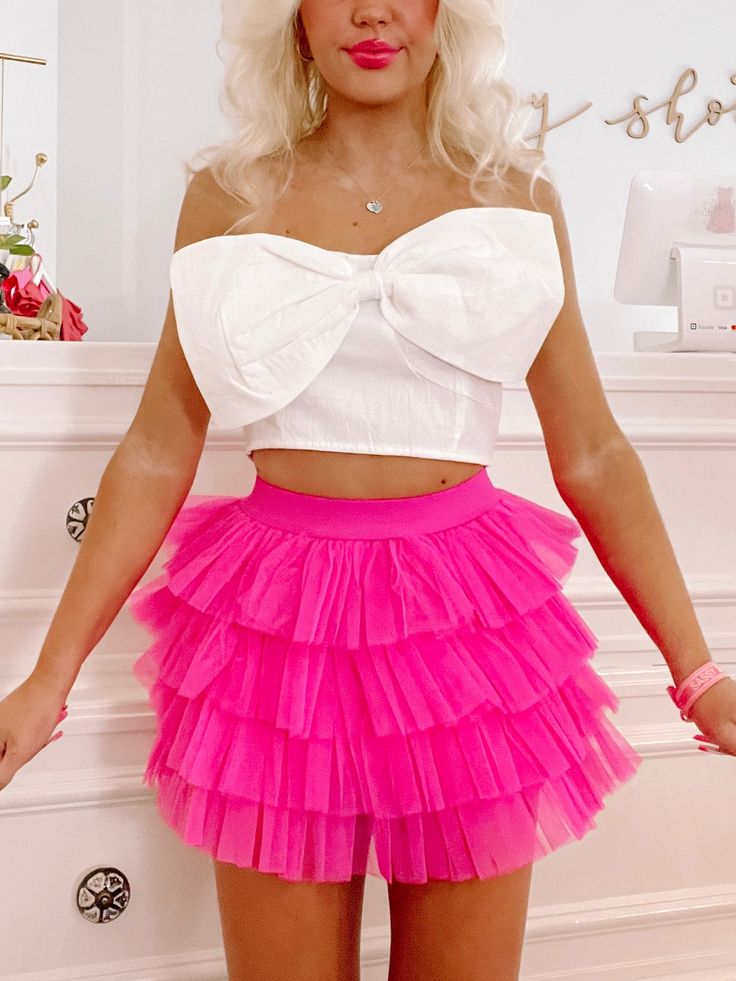 The Trixie Tulle Skirt from Sassy Shortcake is a tiered ruffle bright pink tulle skort. She features an elastic waistband. Lined. Model wearing a size small. content: 100% polyester Mini Tulle Skirt, Hot Pink Skirts, Sparkle Romper, Sassy Shortcake, Tulle Skirts Outfit, Sorority Recruitment Outfits, Feather Gown, Rush Outfits, Recruitment Outfits