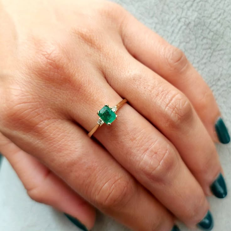 Gold Ring set with Diamonds and Emerald , engagement ring, Gold ring, Natural stone, Birthstone ring, Gemstone ring, Solid 14k, Promise ring. This handmade Gold ring with Diamonds and Emerald is made of 14K genuine gold and set with one Natural stone. This Stunning Ring is High end finish. This 14k Gold ring with green stone can serve as an Birthstone ring or a birthday gift. Stone size is 4/5 mm octagon cut Emeralds are known to heal both emotional love and the physical heart. It is a powerful Elegant Princess Cut Emerald Ring For Promise, Elegant Princess Cut Emerald Promise Ring, Elegant Solitaire Baguette Cut Birthstone Ring, Elegant Baguette Cut Emerald Ring For Promise, Elegant Emerald Ring With Princess Cut And Accent Stones, Promise Princess Cut Emerald Ring With Center Stone, Princess Cut Emerald Promise Ring With Center Stone, Elegant Princess Cut Emerald Ring With Accent Stones, Elegant Ring With May Birthstone Center Stone