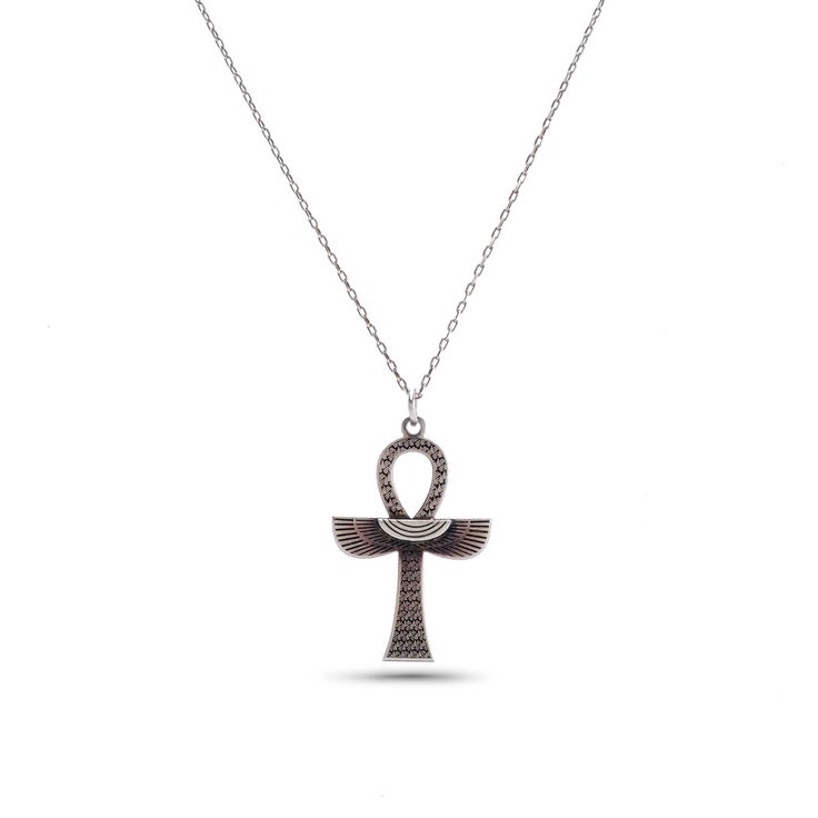 an egyptian symbol necklace on a chain with the letter o in silver and black diamonds