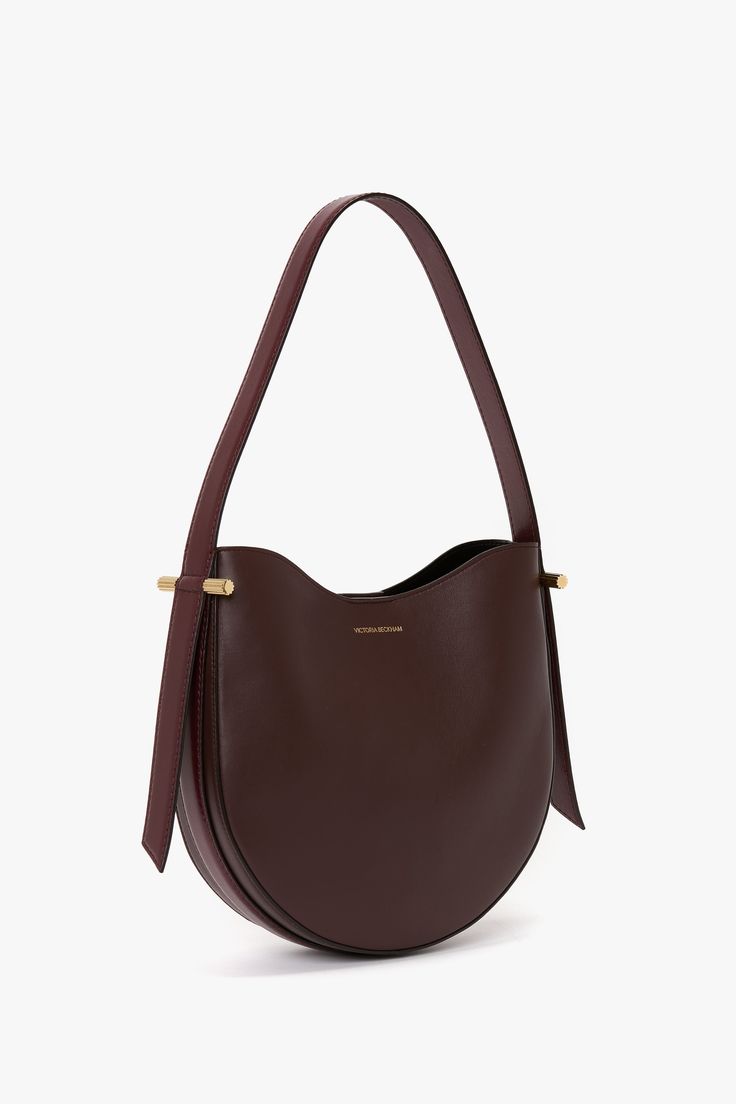 Elevate your everyday style with the Victoria Beckham Hobo Bag in burgundy, where timeless sophistication meets practical design. Crafted from the finest supple leather, this bag offers a relaxed silhouette that embodies understated luxury. Its slouchy, yet structured shape drapes beautifully whether worn over the shoulder or carried by hand, offering a versatile, casual-chic look. Victoria Beckham Medium Dia Hobo Bag In Burgundy Smooth Leather  - Size ONE SIZE UK Daily Use Burgundy Hobo Bag With Double Handle, Elegant Luxury Burgundy Hobo Bag, Elegant Burgundy Tote Hobo Bag, Burgundy Double Handle Hobo Bag, Burgundy Hobo Bag With Leather Handles, Hobo Bag, Smooth Leather, Victoria Beckham, Casual Chic