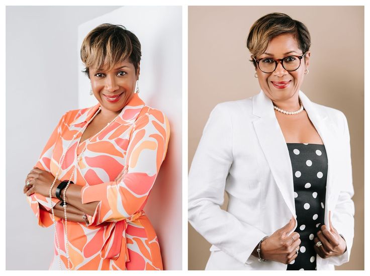 two women are smiling and one is wearing a white blazer with polka dots on it