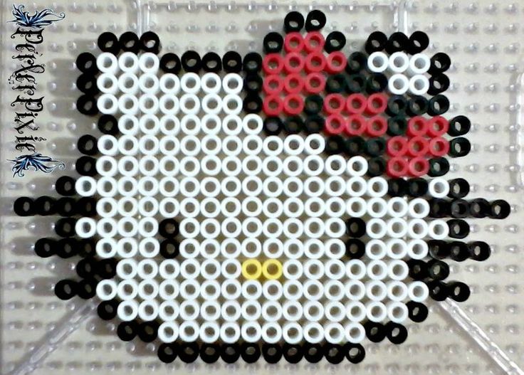 a close up of a hello kitty bead pattern on a piece of plastic material