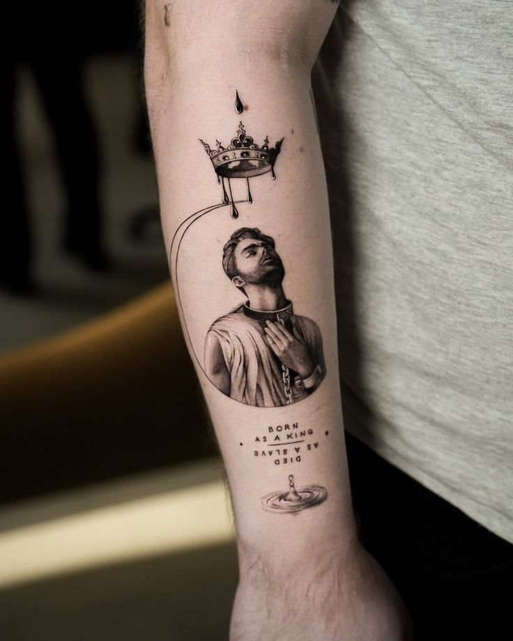 a man with a crown tattoo on his arm