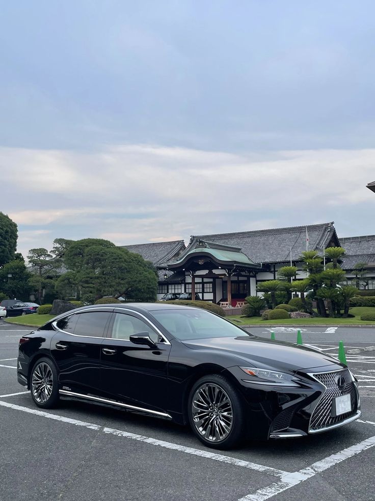 a black car parked in a parking lot