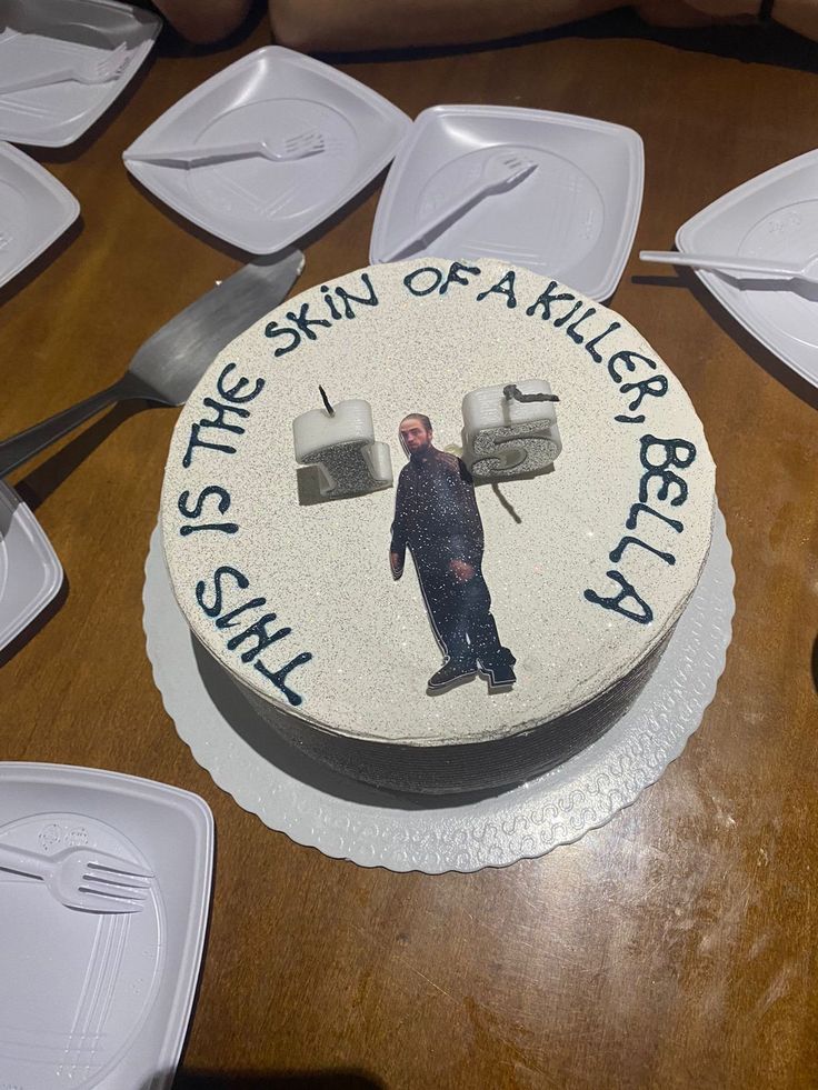 there is a cake on the table that has been decorated with an image of a man