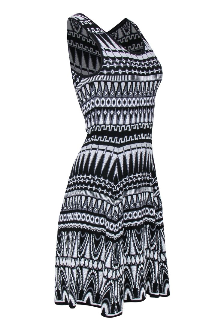 Get some Art Deco darling vibes with this graphic knit beauty from Milly! Made with a stretchy knit, this is the perfect piece to wear with heeled booties and a red lip for your next evening cocktail hour or dinner party!. Size M 63% Viscose, 27% Rayon A-line silhouette Scoop neckline Knit provides stretch Zippered back Waist 24" Bust 28" Total length 40" Trendy Fitted Knit Dress, Fitted Jacquard Knit Summer Dress, Chic Fitted Jacquard Knit Dress, Spring Jacquard Knit Dress, Casual Fitted Jacquard Knit Dress, Fitted Casual Jacquard Knit Dress, French Girl Chic, Chic Shop, Black White Pattern