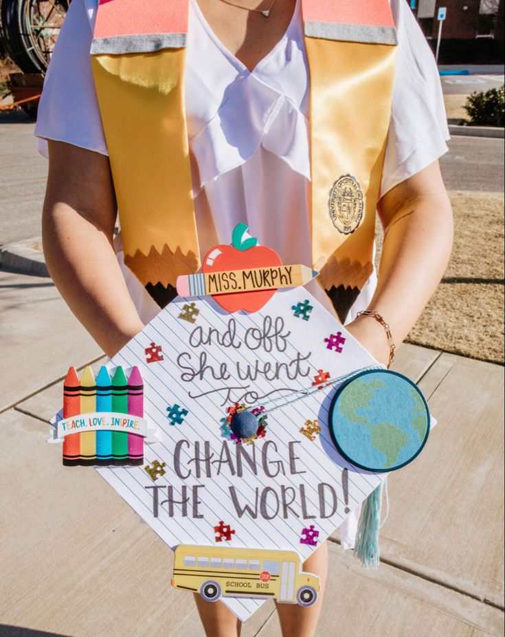 a person wearing a costume made to look like a school bus driver holding a sign that says change the world