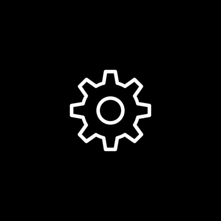 a black and white image of a cogwheel