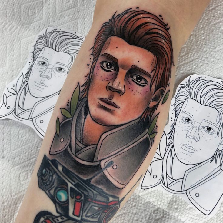 a man's arm with an image of himself on it and three other people in the background