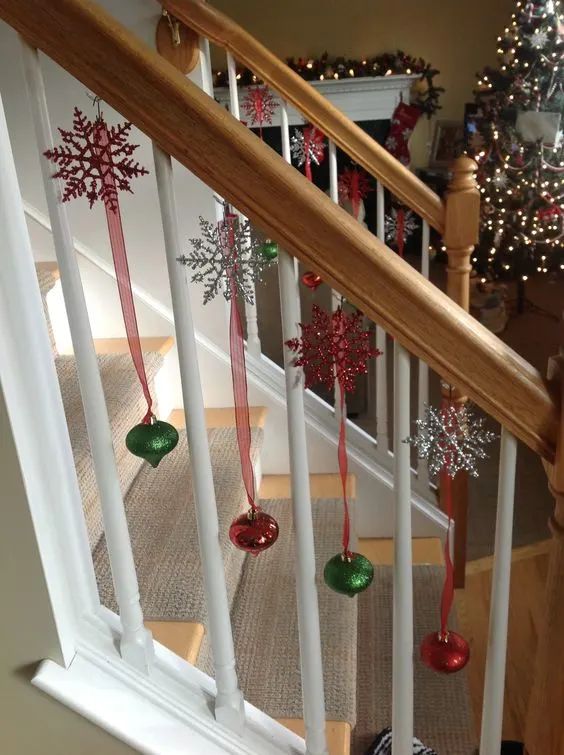 christmas decorations are hanging on the banister