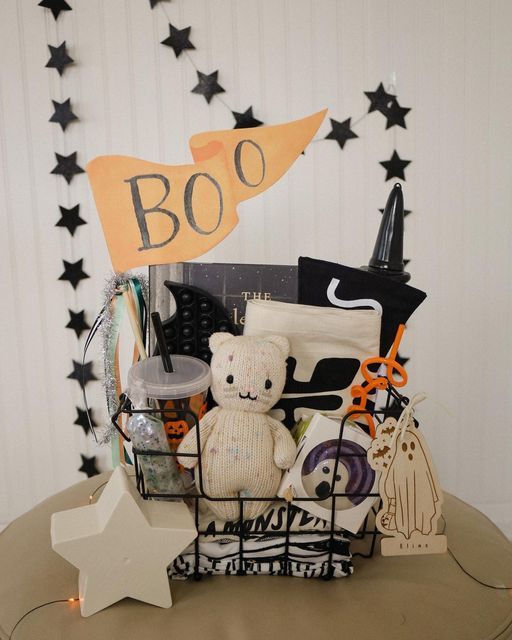 a basket filled with lots of items on top of a table next to a sign