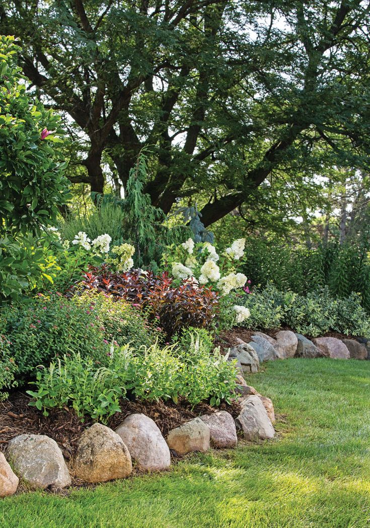 there is a rock garden in the grass