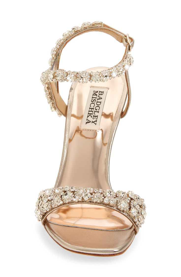 Sparkling crystals embellish the straps of an elegant sandal lifted by a metallic setback heel. 4" heel Adjustable ankle strap with buckle closure Cushioned footbed Leather or textile upper/synthetic and leather lining/leather sole Imported Women's Shoes Sparkle Wedding Shoes, Heels Classy Elegant, Cute Shoes Heels, Elegant Sandals, Heels Classy, Crystal Shoes, Glamorous Style, Embellished Sandals, Gold Shoes