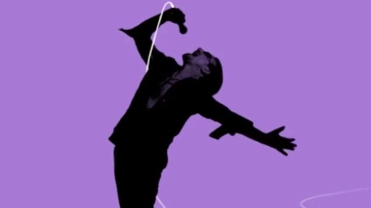 the silhouette of a man with headphones on his ears is in front of a purple background