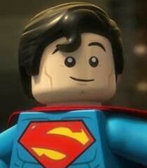 a close up of a lego man wearing a superman suit