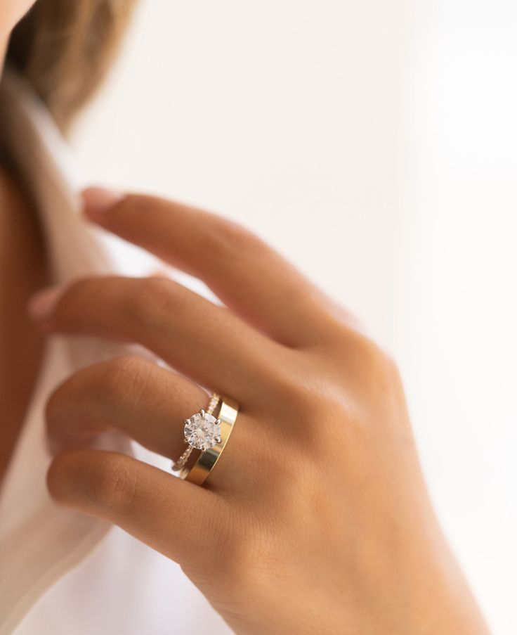 a close up of a person wearing a ring