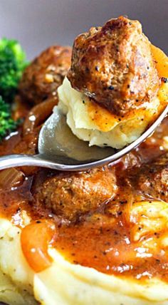 meatballs and mashed potatoes in gravy with broccoli