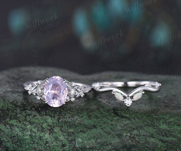 two engagement rings with an oval pink stone in the center