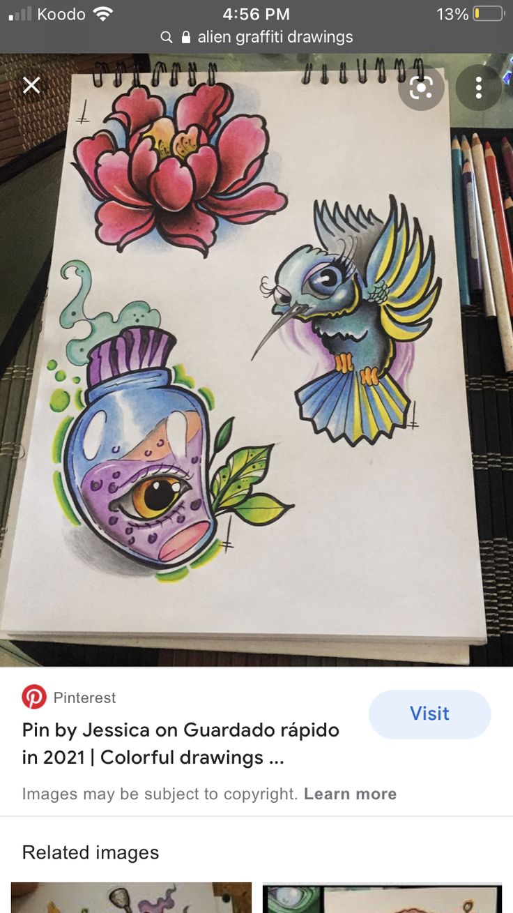 a notebook with drawings of birds and flowers on it