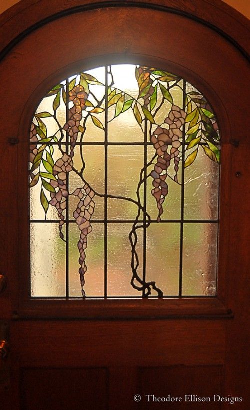 a wooden door with a stained glass window