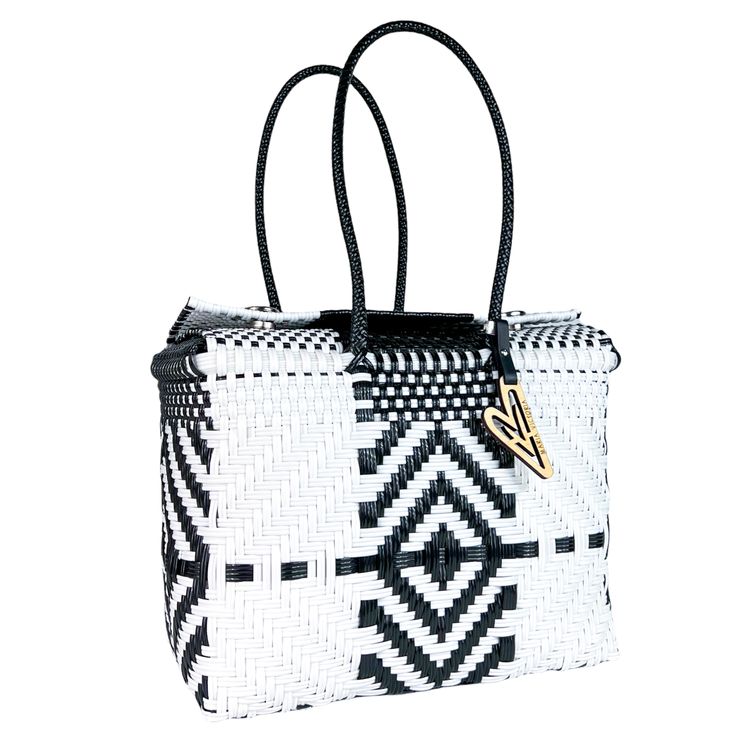 a black and white handbag on a white background