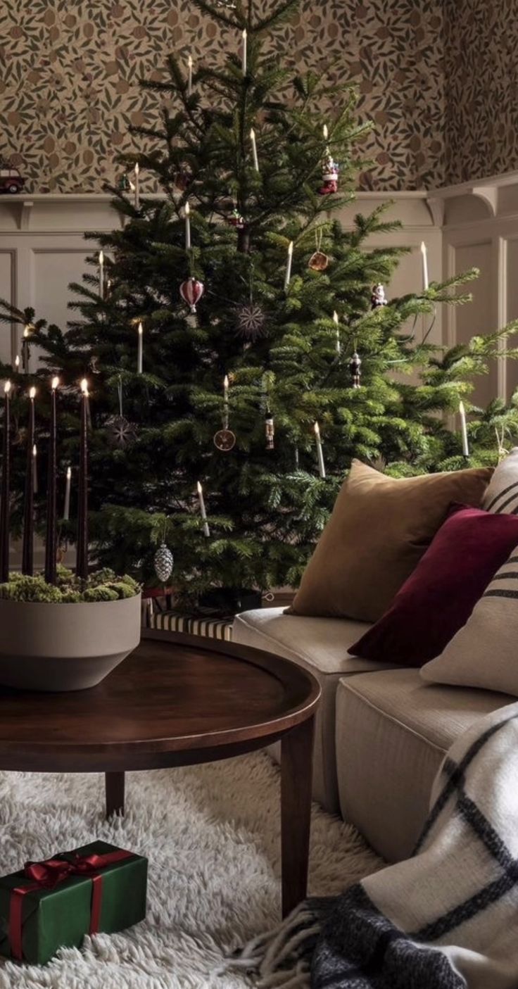 a living room with a christmas tree in the corner