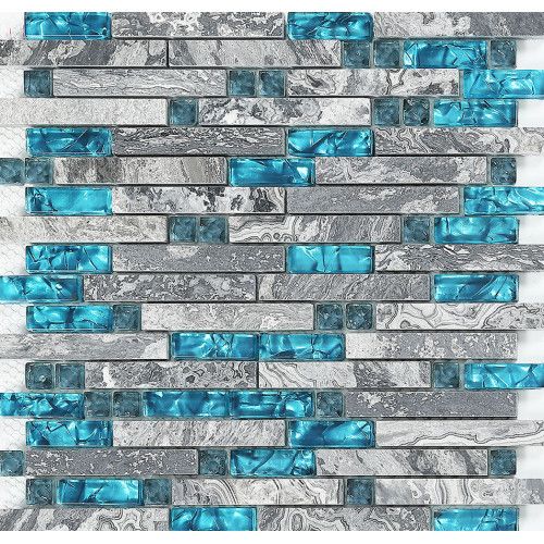 blue and gray glass tile backsplash with silver foil on the bottom, in an irregular pattern