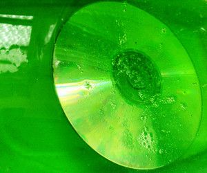 a close up view of a green cd