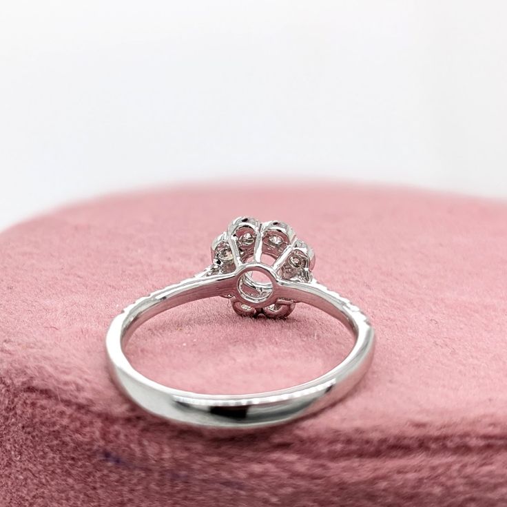 This dainty diamond ring semi mount features a round shape setting framed with a flower designed diamond halo. A classic ring design perfect for an anniversary or as an engagement ring. This ring also makes a beautiful birthstone ring for your loved ones! Available in multiple colors of 14K Gold: Yellow, White and Rose. Interested in purchasing with a center stone? Message our shop and we can help you find the perfect stone! Diamond Flower Ring With Halo Design For Promise, Classic Diamond Flower Ring With Halo Design, Diamond Flower Ring With Halo Setting For Anniversary, White Gold Flower Ring With Halo Setting For Wedding, Formal Flower Ring With Halo Setting And Round Cut, Round Cut Diamond Ring With Halo Setting For Proposal, Luxury Round Cut Diamond Ring With Halo Setting, Diamond White Flower Ring With Halo Setting, Classic Diamond Flower Ring With Halo Setting