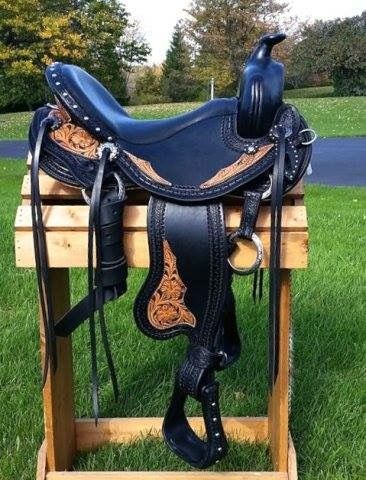 a horse saddle sitting on top of a wooden stand