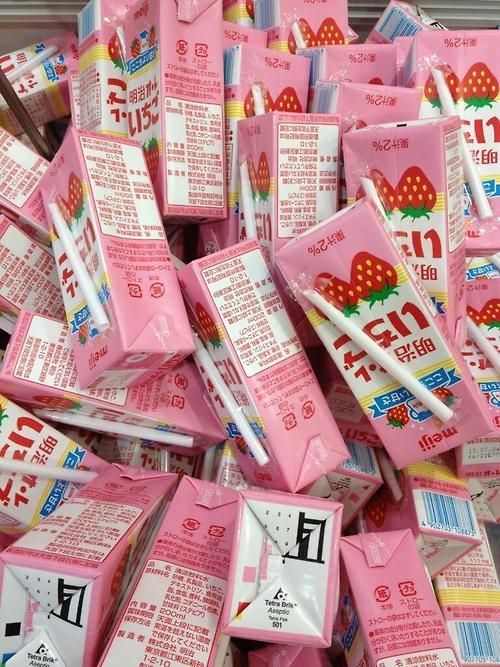 a pile of pink packets with strawberries on them