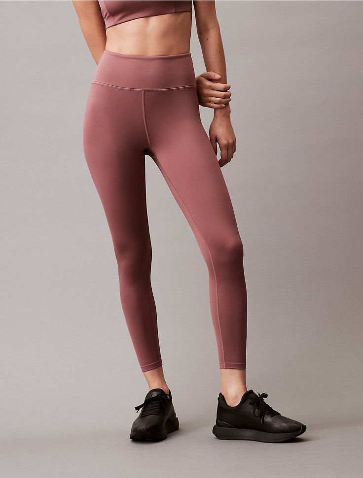 Minimalist with a solid body, these leggings are constructed from moisture-wicking fabric for total comfort and breathability during workouts. Created with a high rise waist and a slim, fitted silhouette in a 7/8 length. Designed with an elastic waistband and a tonal Calvin Klein logo at the lower leg.  Material: 88% Polyester, 12% Elastane. Lower Leg, Moisture Wicking Fabric, Moisture Wicking, Calvin Klein, Leggings, High Waisted